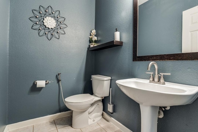 431 Lakefield Dr, Murphy, TX 75094 - bathroom with tile patterned floors, toilet, and baseboards