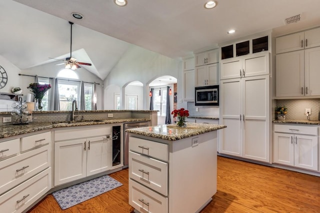 431 Lakefield Dr, Murphy, TX 75094 - kitchen featuring a sink, plenty of natural light, a ceiling fan, arched walkways, and recessed lighting