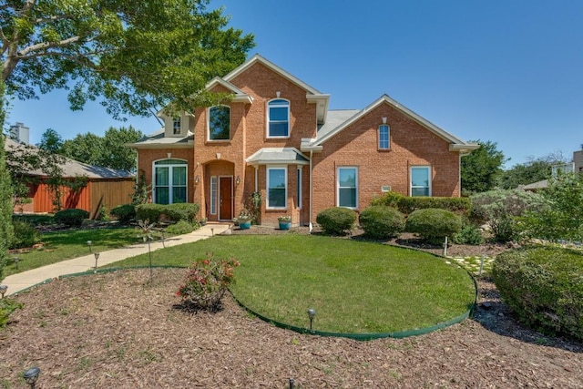431 Lakefield Dr, Murphy, TX 75094 - traditional-style house featuring brick siding and a front lawn