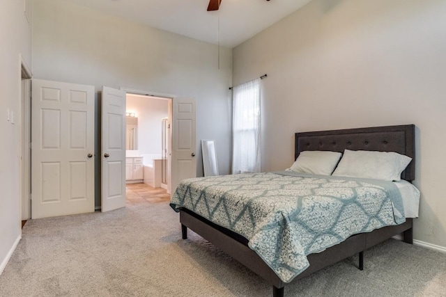 431 Lakefield Dr, Murphy, TX 75094 - bedroom with light carpet, a towering ceiling, connected bathroom, baseboards, and ceiling fan