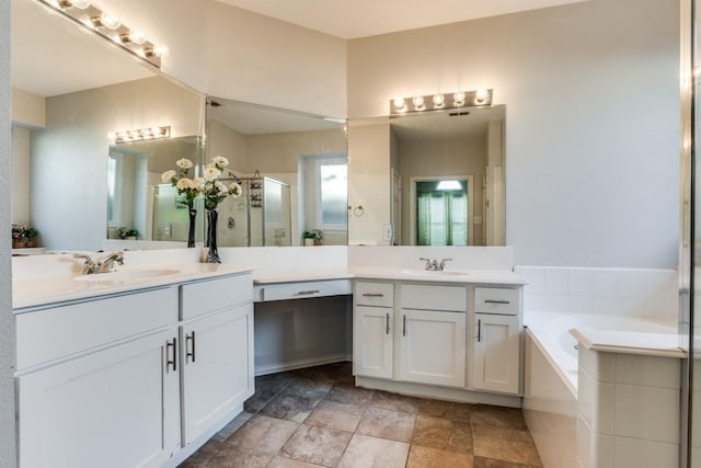 431 Lakefield Dr, Murphy, TX 75094 - bathroom with two vanities, a shower stall, and a bath