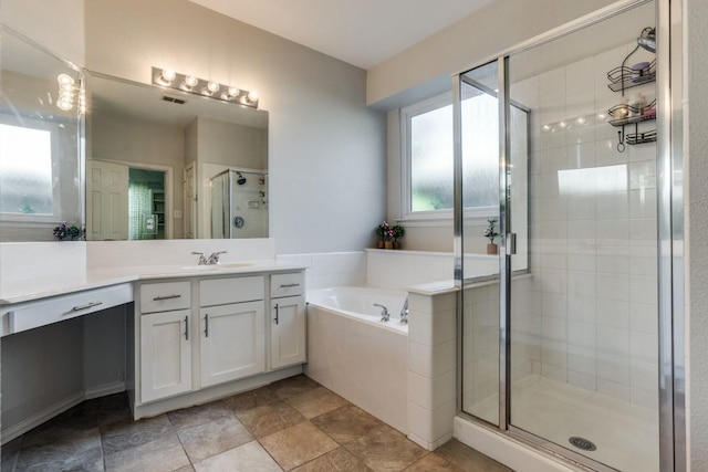 431 Lakefield Dr, Murphy, TX 75094 - full bath with vanity, a shower stall, a garden tub, and stone finish floors