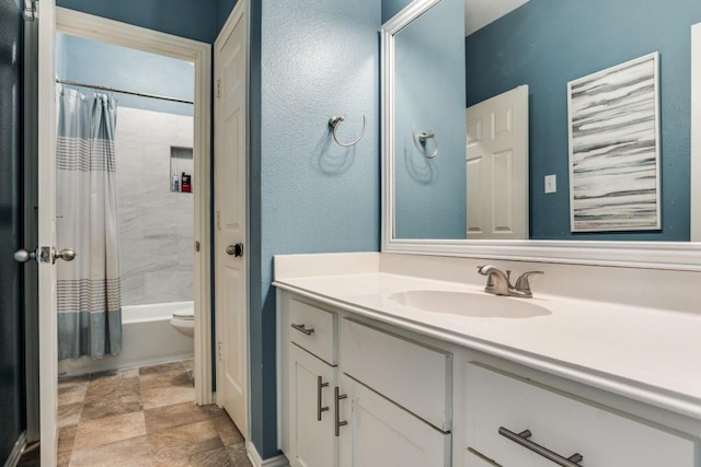 431 Lakefield Dr, Murphy, TX 75094 - bathroom with vanity, shower / bath combo, toilet, and stone finish floors