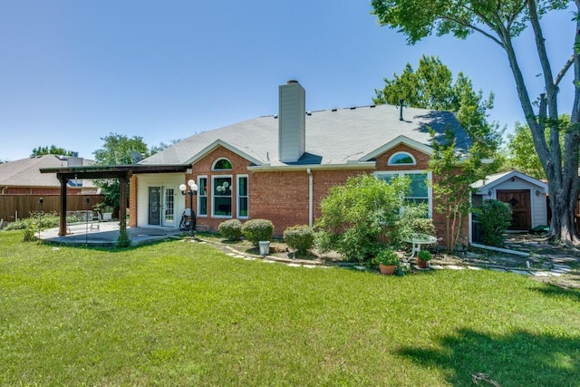 431 Lakefield Dr, Murphy, TX 75094 - back of house featuring a patio area, a chimney, brick siding, and french doors