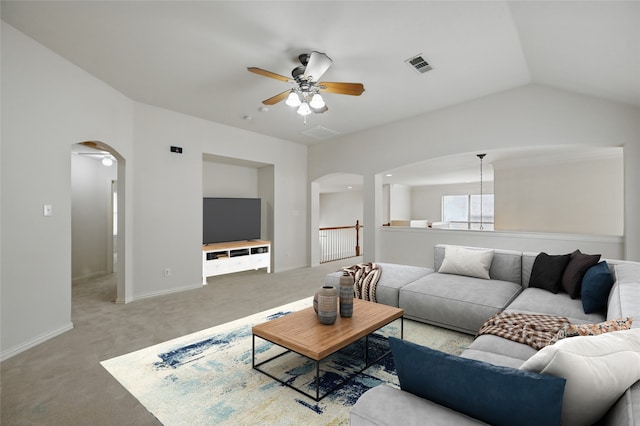 3816 Appleton Ln, Flower Mound, TX 75022 - carpeted living room with arched walkways, ceiling fan, and vaulted ceiling