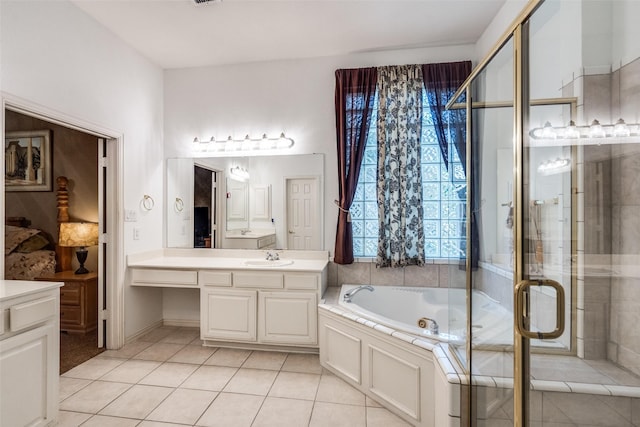 8017 Stonehill Dr, Plano, TX 75025 - bathroom featuring vanity, tile patterned flooring, a bath, and a shower stall