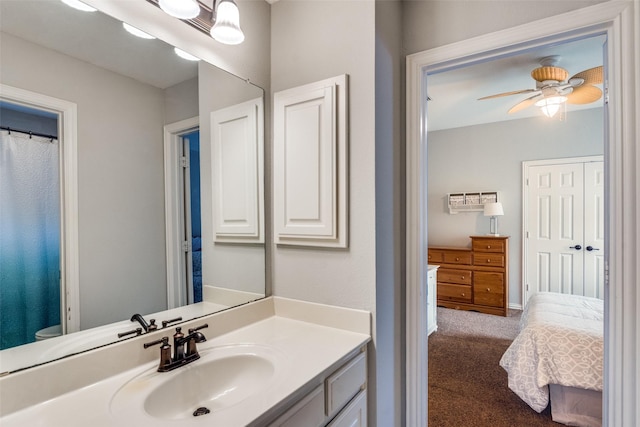 8017 Stonehill Dr, Plano, TX 75025 - bathroom with vanity, toilet, ceiling fan, and baseboards