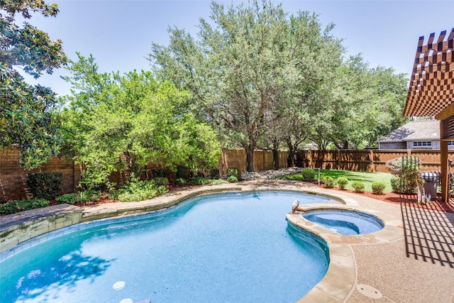 8017 Stonehill Dr, Plano, TX 75025 - view of swimming pool featuring a fenced backyard and a pool with connected hot tub