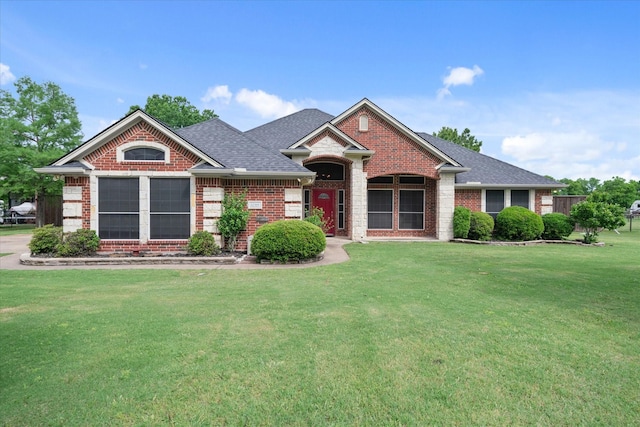 12319 N Emerald Ranch Ln, Forney, TX 75126 - view of front of home featuring brick siding, a front yard, and roof with shingles