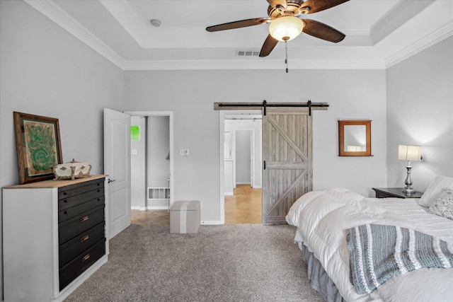 12319 N Emerald Ranch Ln, Forney, TX 75126 - bedroom with a raised ceiling, a barn door, ornamental molding, light colored carpet, and ceiling fan