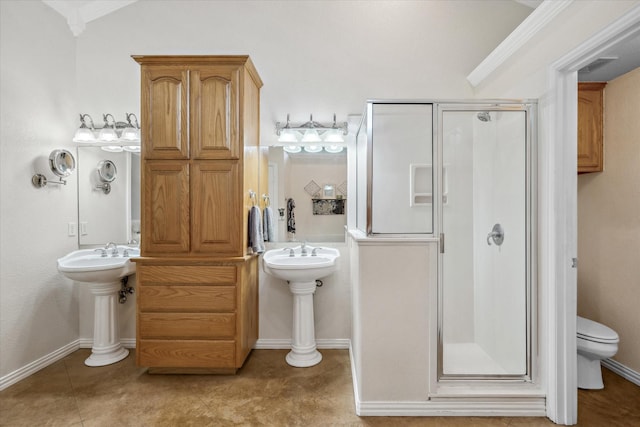 12319 N Emerald Ranch Ln, Forney, TX 75126 - bathroom with a stall shower, toilet, ornamental molding, tile patterned floors, and a sink