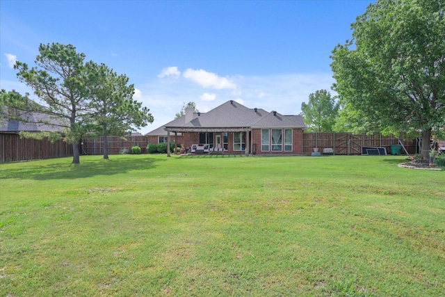 12319 N Emerald Ranch Ln, Forney, TX 75126 - rear view of house featuring brick siding