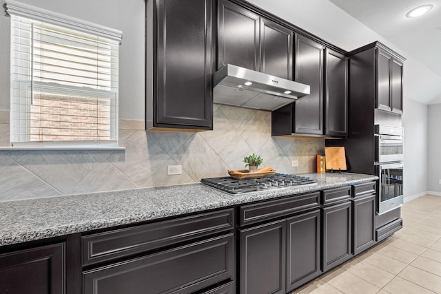 952 Sweeping Butte Dr, Fort Worth, TX 76052 - kitchen with exhaust hood, appliances with stainless steel finishes, decorative backsplash, and light tile patterned floors