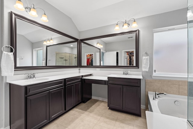 952 Sweeping Butte Dr, Fort Worth, TX 76052 - full bath with lofted ceiling, vanity, a garden tub, tile patterned floors, and a shower with door