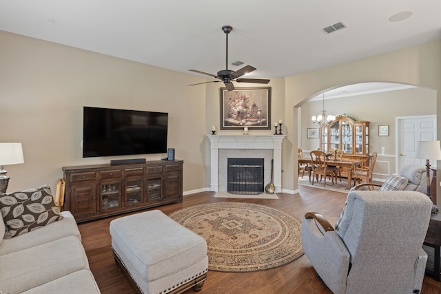 936 Medinah Dr, Fairview, TX 75069 - living room featuring arched walkways, a ceiling fan, wood finished floors, and a chandelier