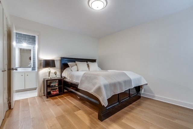 9616 Viewside Dr, Dallas, TX 75231 - bedroom with light wood-type flooring and baseboards