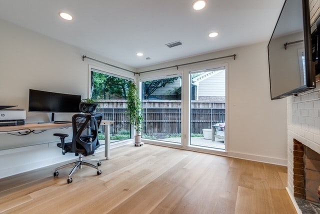 9616 Viewside Dr, Dallas, TX 75231 - office with wood finished floors, recessed lighting, and a brick fireplace