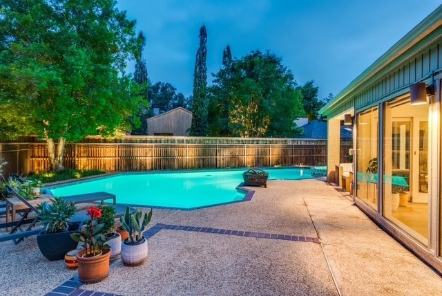 9616 Viewside Dr, Dallas, TX 75231 - view of swimming pool featuring a patio area and a fenced backyard