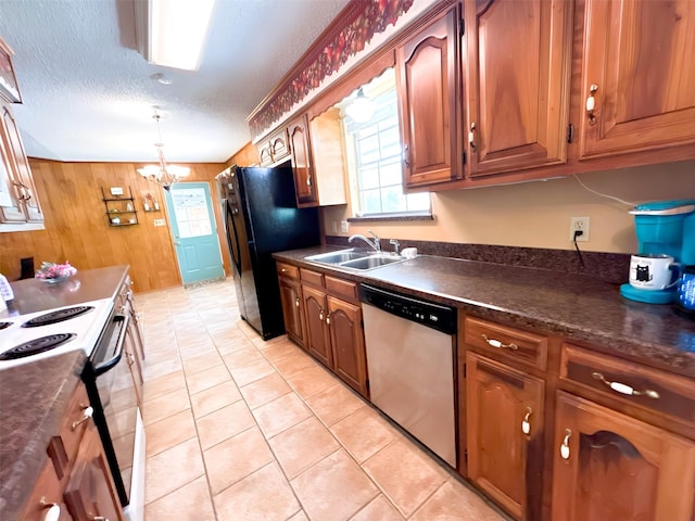 107 W Bayside Dr, Mabank, TX 75156 - kitchen featuring stainless steel dishwasher, a sink, range with electric cooktop, dark countertops, and a chandelier