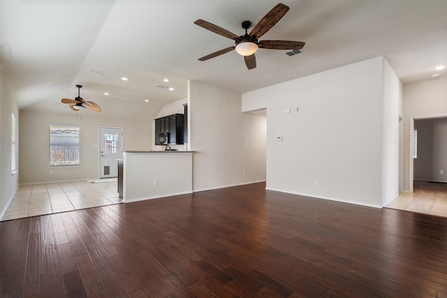 1016 Camp Verde Dr, Forney, TX 75126 - unfurnished living room featuring ceiling fan, lofted ceiling, light wood-style flooring, baseboards, and recessed lighting