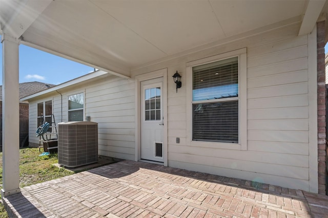 1016 Camp Verde Dr, Forney, TX 75126 - property entrance featuring central AC unit and a patio area