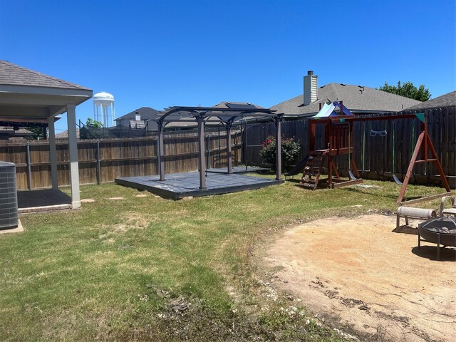 1016 Camp Verde Dr, Forney, TX 75126 - view of yard with a playground, a gazebo, central air condition unit, a deck, and an outdoor fire pit
