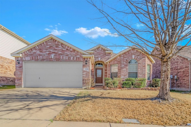 1016 Camp Verde Dr, Forney, TX 75126 - view of front of property with brick siding, driveway, a garage, and a front lawn