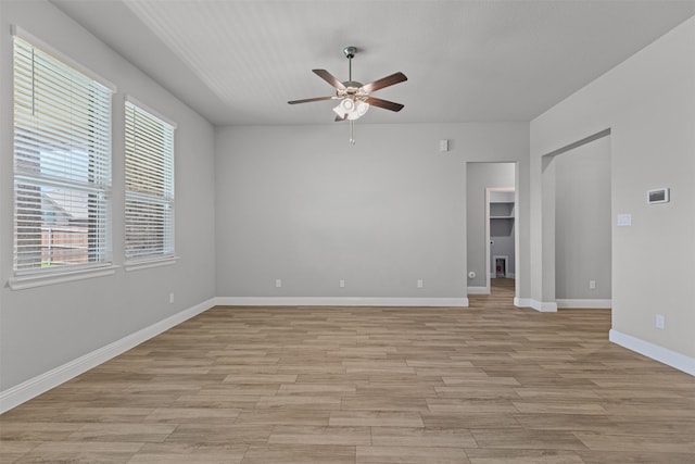 3640 Twin Pines Dr, Grand Prairie, TX 76065 - unfurnished room featuring a ceiling fan, healthy amount of natural light, light wood-style floors, and baseboards