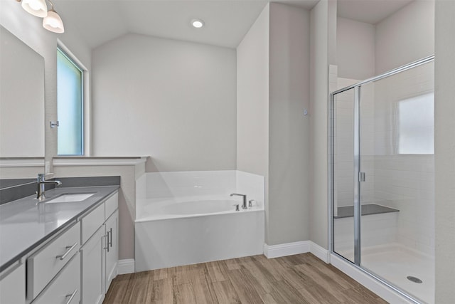3640 Twin Pines Dr, Grand Prairie, TX 76065 - full bath with vanity, a stall shower, wood finished floors, a garden tub, and baseboards