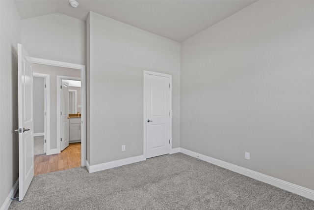 3640 Twin Pines Dr, Grand Prairie, TX 76065 - unfurnished bedroom with carpet floors, baseboards, ensuite bath, and high vaulted ceiling