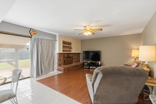 4028 Engleman St, Fort Worth, TX 76137 - living area with a ceiling fan, a fireplace, and tile patterned floors