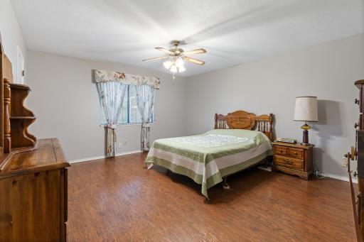 4028 Engleman St, Fort Worth, TX 76137 - bedroom with wood finished floors, baseboards, and a ceiling fan