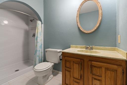 4028 Engleman St, Fort Worth, TX 76137 - full bathroom featuring toilet, tile patterned flooring, curtained shower, and vanity
