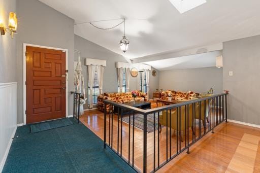 4028 Engleman St, Fort Worth, TX 76137 - foyer entrance featuring a skylight, vaulted ceiling, and wood finished floors