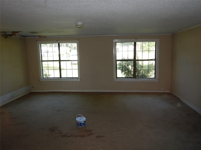 7519 Henderson Gin Rd, Shreveport, LA 71107 - carpeted empty room featuring plenty of natural light, a textured ceiling, crown molding, and baseboards