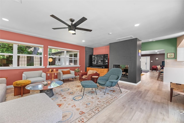 9918 Ila Dr, Dallas, TX 75220 - living room featuring a ceiling fan, light wood-style floors, recessed lighting, and a fireplace