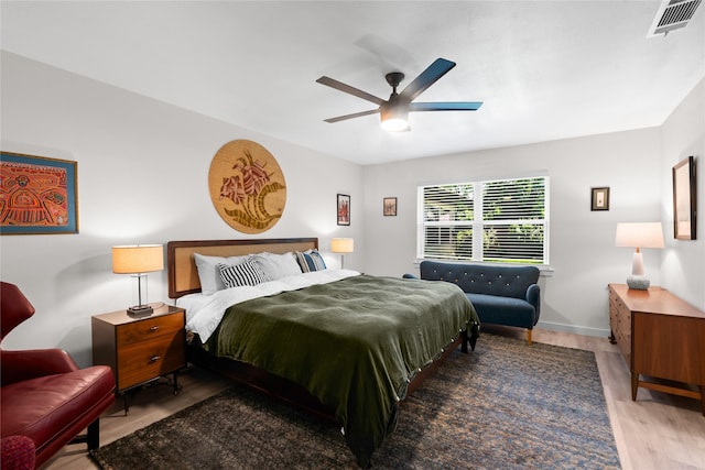 9918 Ila Dr, Dallas, TX 75220 - bedroom featuring wood finished floors and a ceiling fan