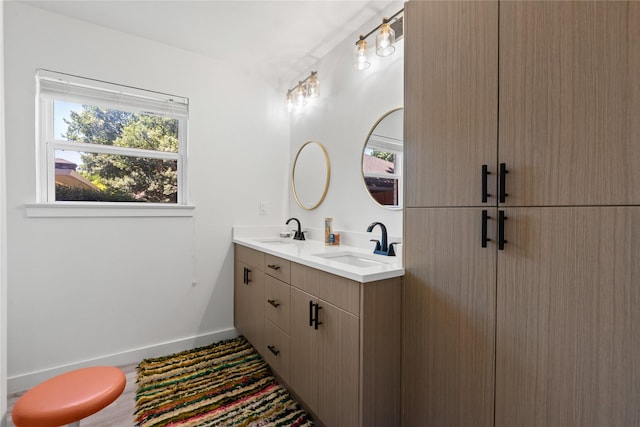 9918 Ila Dr, Dallas, TX 75220 - bathroom with double vanity and baseboards