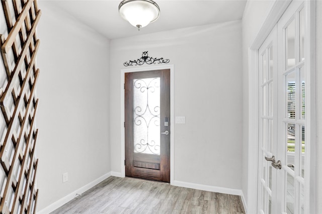 1135 Saddle Ridge Dr, Aubrey, TX 76227 - entrance foyer featuring light wood-style floors, baseboards, and french doors
