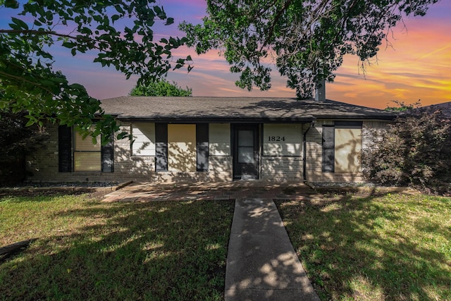 1824 Angelina Dr, Garland, TX 75040 - view of front of home with a lawn, brick siding, and a shingled roof