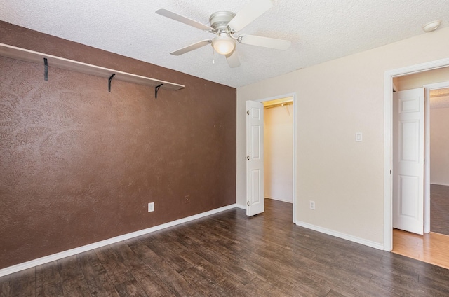 1824 Angelina Dr, Garland, TX 75040 - unfurnished bedroom with wood finished floors, baseboards, a textured ceiling, a ceiling fan, and a closet