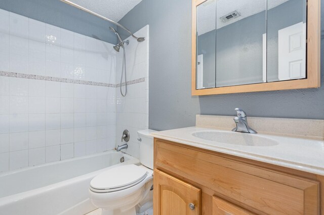 1824 Angelina Dr, Garland, TX 75040 - bathroom with toilet, vanity, and shower / bathtub combination