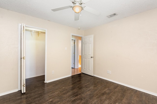 1824 Angelina Dr, Garland, TX 75040 - unfurnished bedroom featuring wood finished floors, baseboards, ceiling fan, a closet, and a textured ceiling