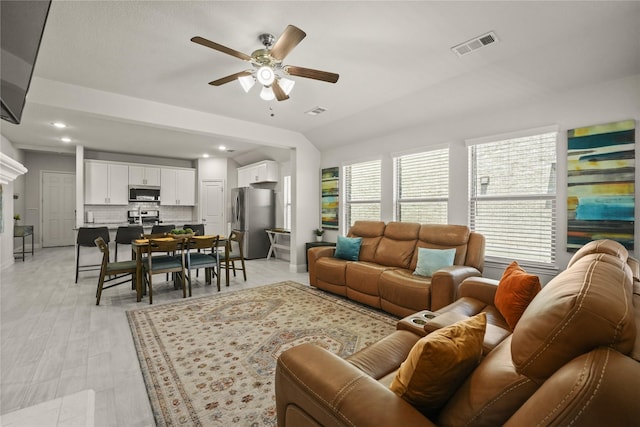 3409 Melrose Ct, Wylie, TX 75098 - living area featuring ceiling fan, vaulted ceiling, light wood-style floors, and recessed lighting
