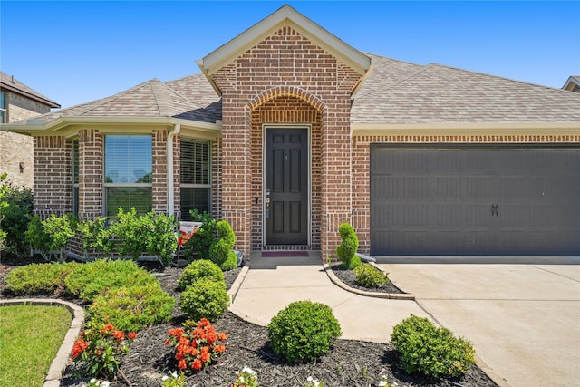 3409 Melrose Ct, Wylie, TX 75098 - view of front facade featuring brick siding, a garage, a shingled roof, and concrete driveway