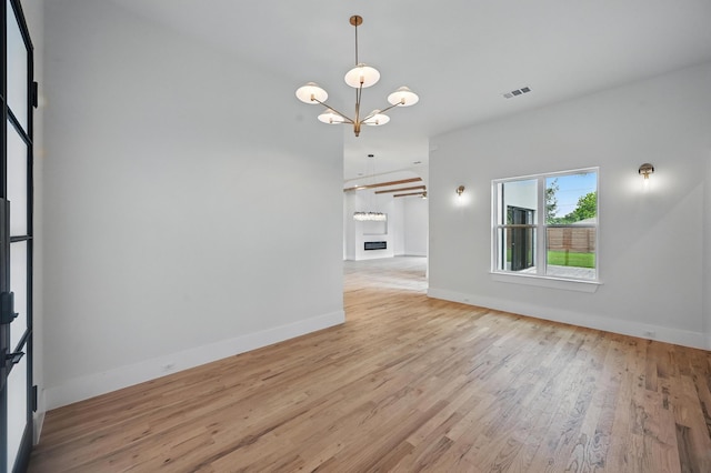 1224 S Pine St, Grapevine, TX 76051 - unfurnished dining area featuring a chandelier, light wood-type flooring, and baseboards