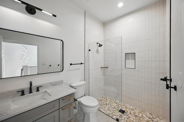 1224 S Pine St, Grapevine, TX 76051 - full bathroom with vanity, toilet, a walk in shower, recessed lighting, and tile patterned floors