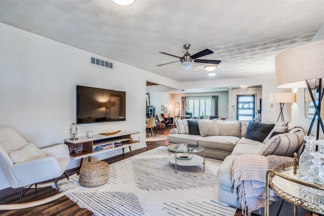 10542 Vinemont St, Dallas, TX 75218 - living room with wood finished floors and a ceiling fan