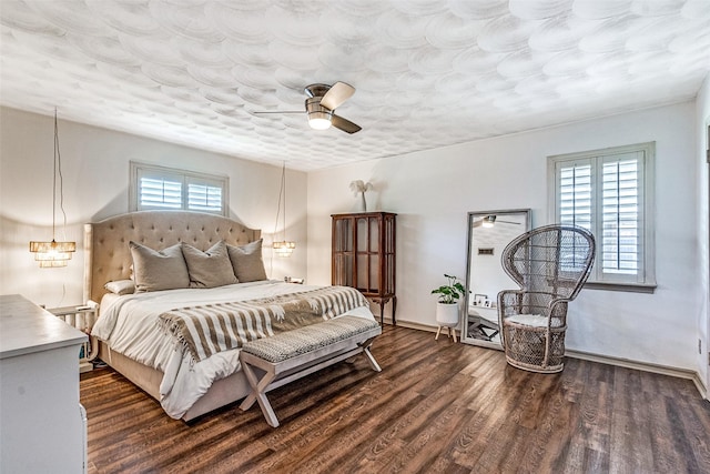 10542 Vinemont St, Dallas, TX 75218 - bedroom featuring dark wood finished floors, baseboards, and ceiling fan