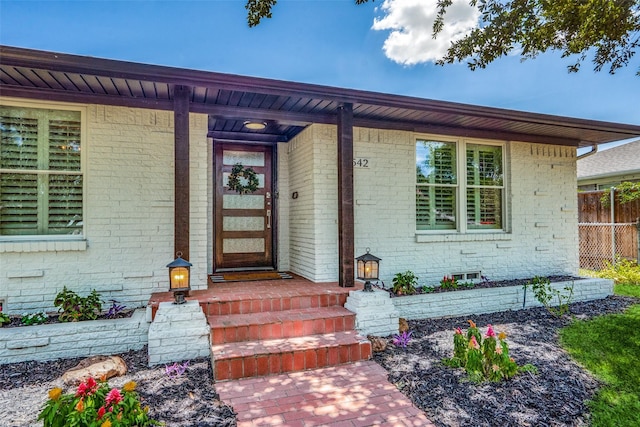 10542 Vinemont St, Dallas, TX 75218 - doorway to property with brick siding